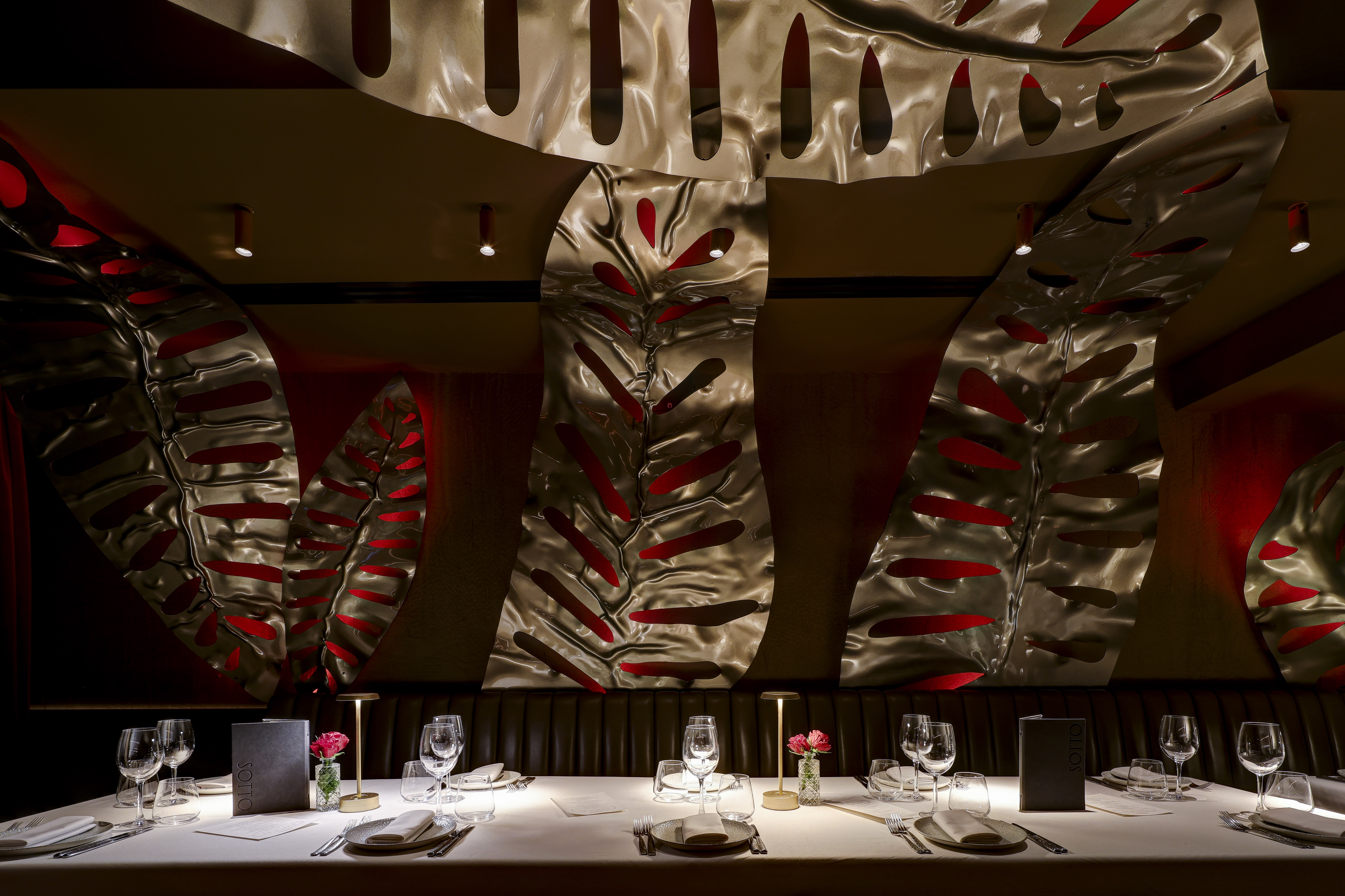 Private dining room in Bocconcino Soho with metallic decor for upscale events.