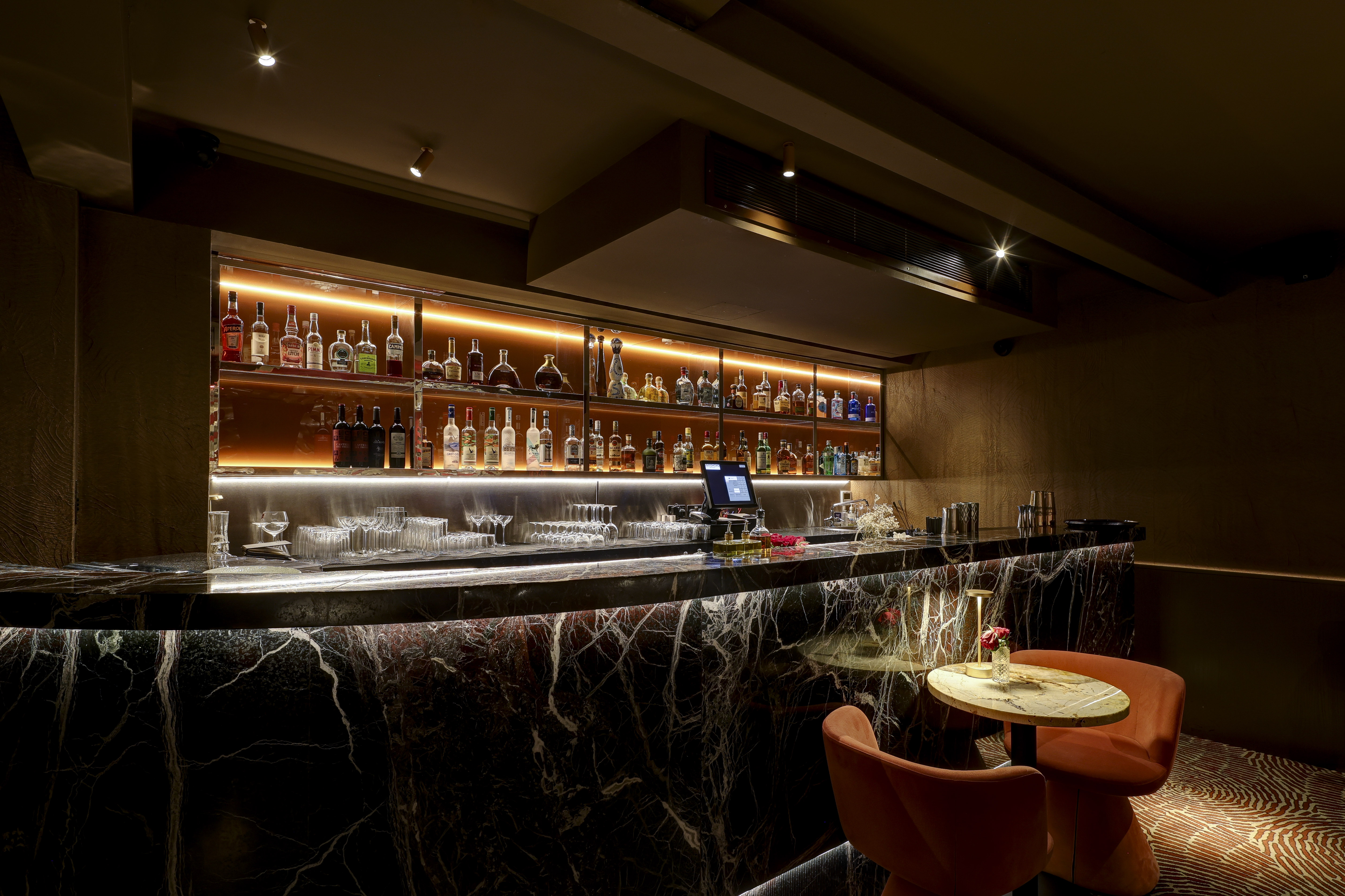 Private dining room at Bocconcino Soho with marble bar, ideal for networking events.