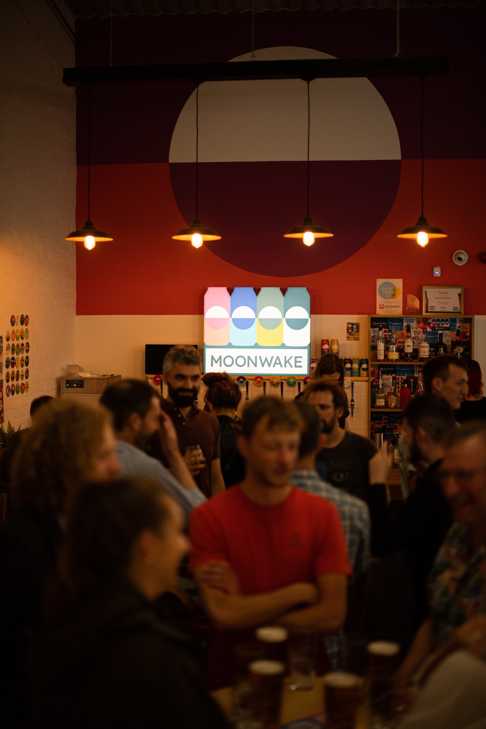 Vibrant social gathering at Moonwake Taproom's Back Bar, perfect for networking events.