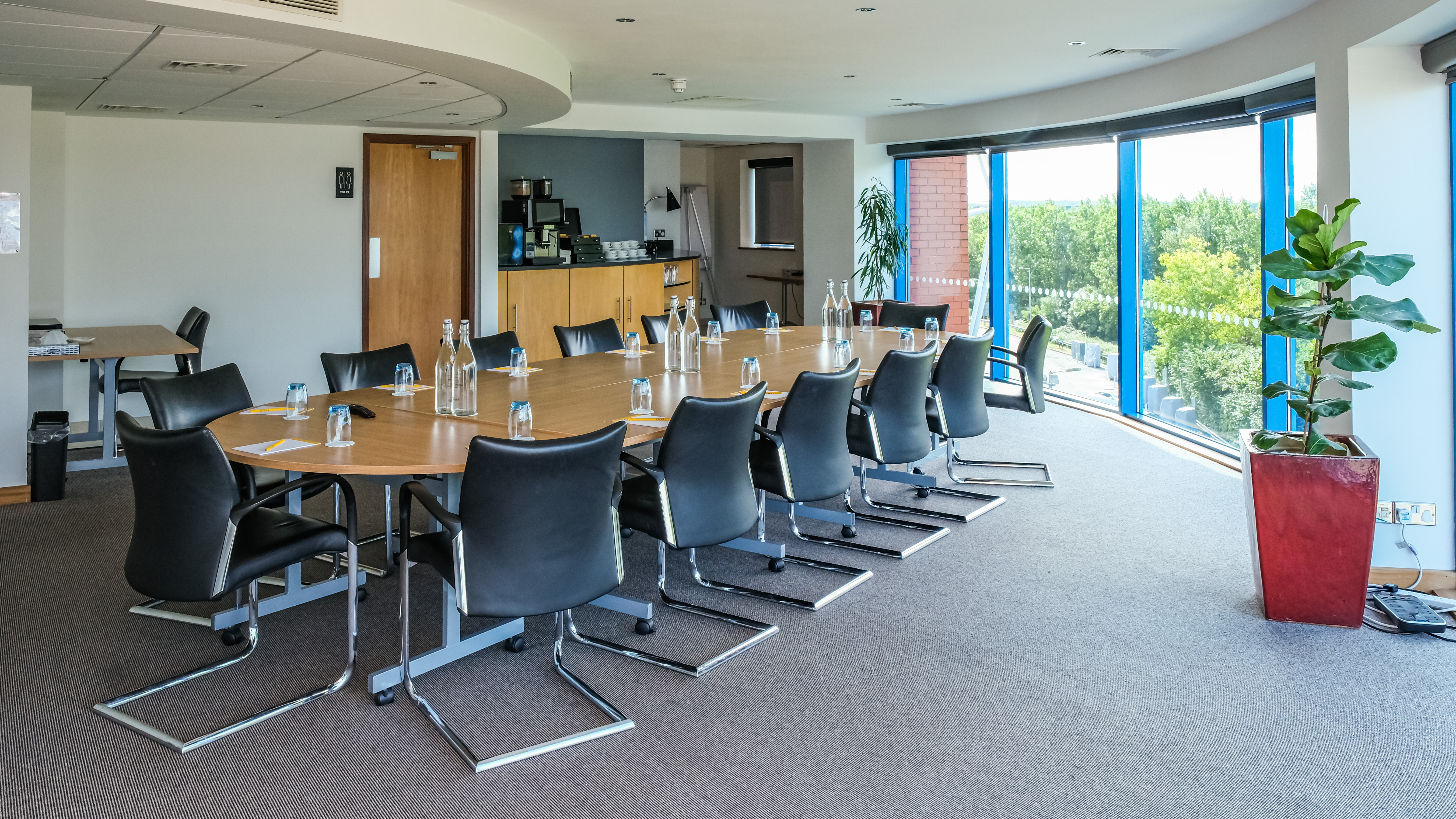 Srivikorn Suite meeting room with oval table, ideal for professional gatherings and events.