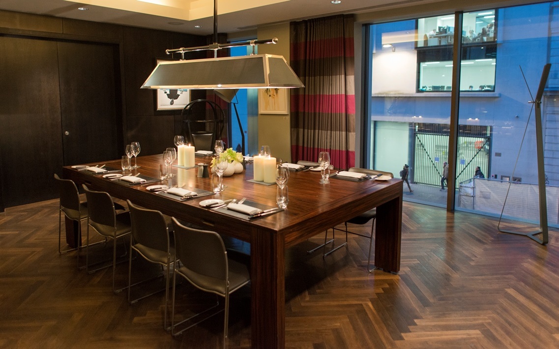 Sophisticated meeting space at South Place Hotel with elegant wooden table for corporate events.