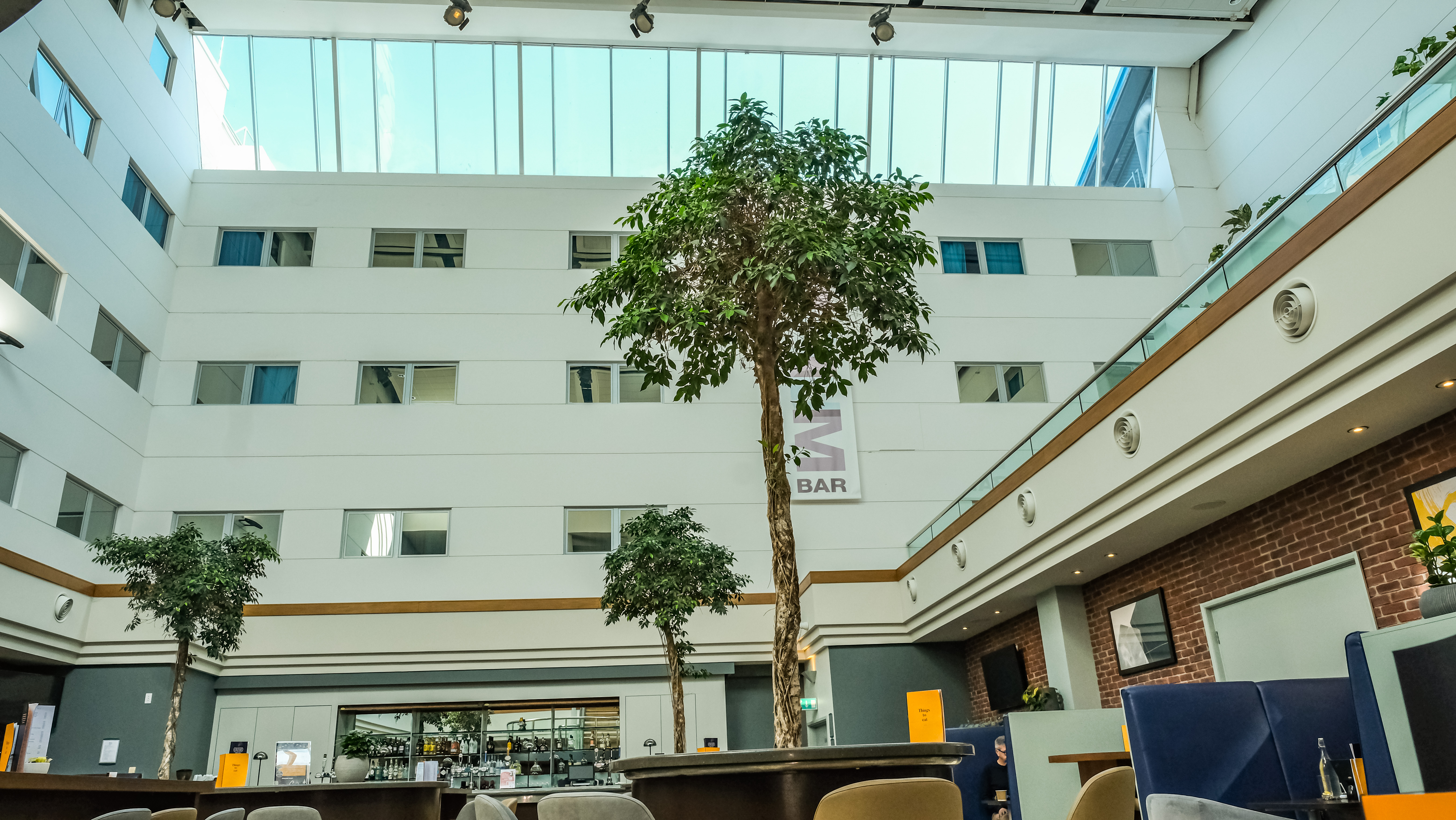Atrium Bar at Voco Reading, spacious venue with natural light for networking events.