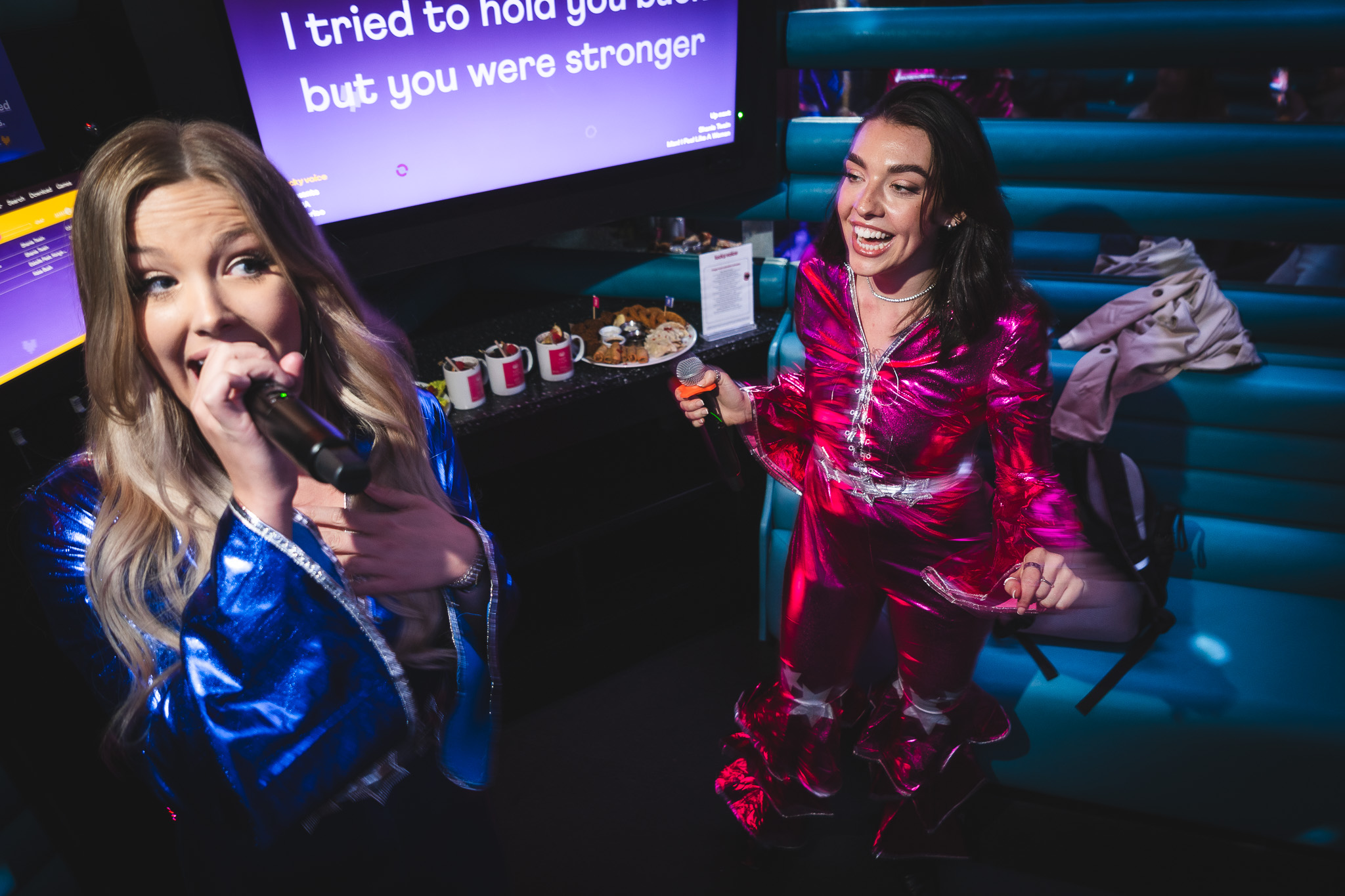 Christmas party at Lucky Voice Waterloo with lively karaoke and colorful outfits.