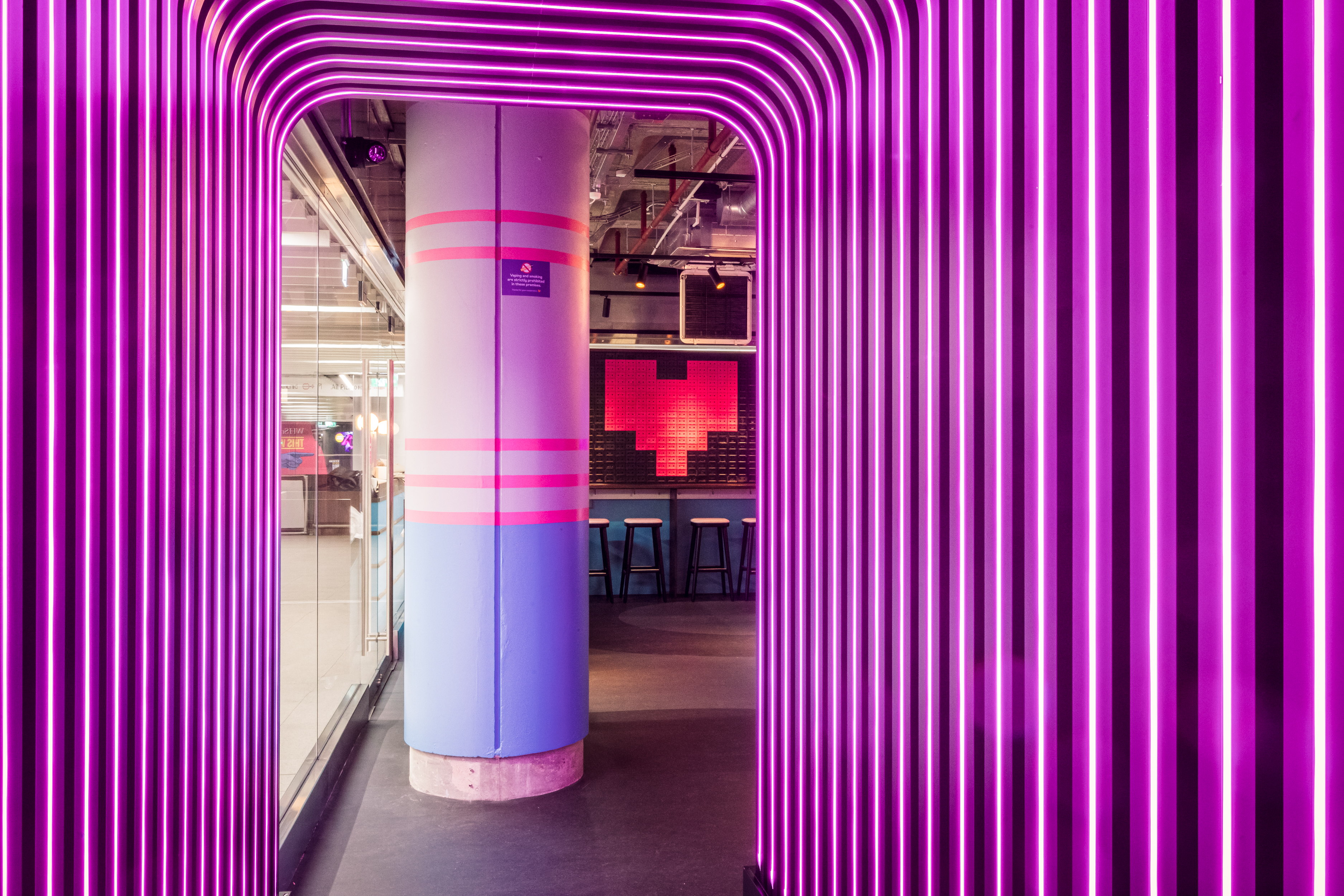 Vibrant summer party at Lucky Voice Waterloo with neon lighting, perfect for networking events.