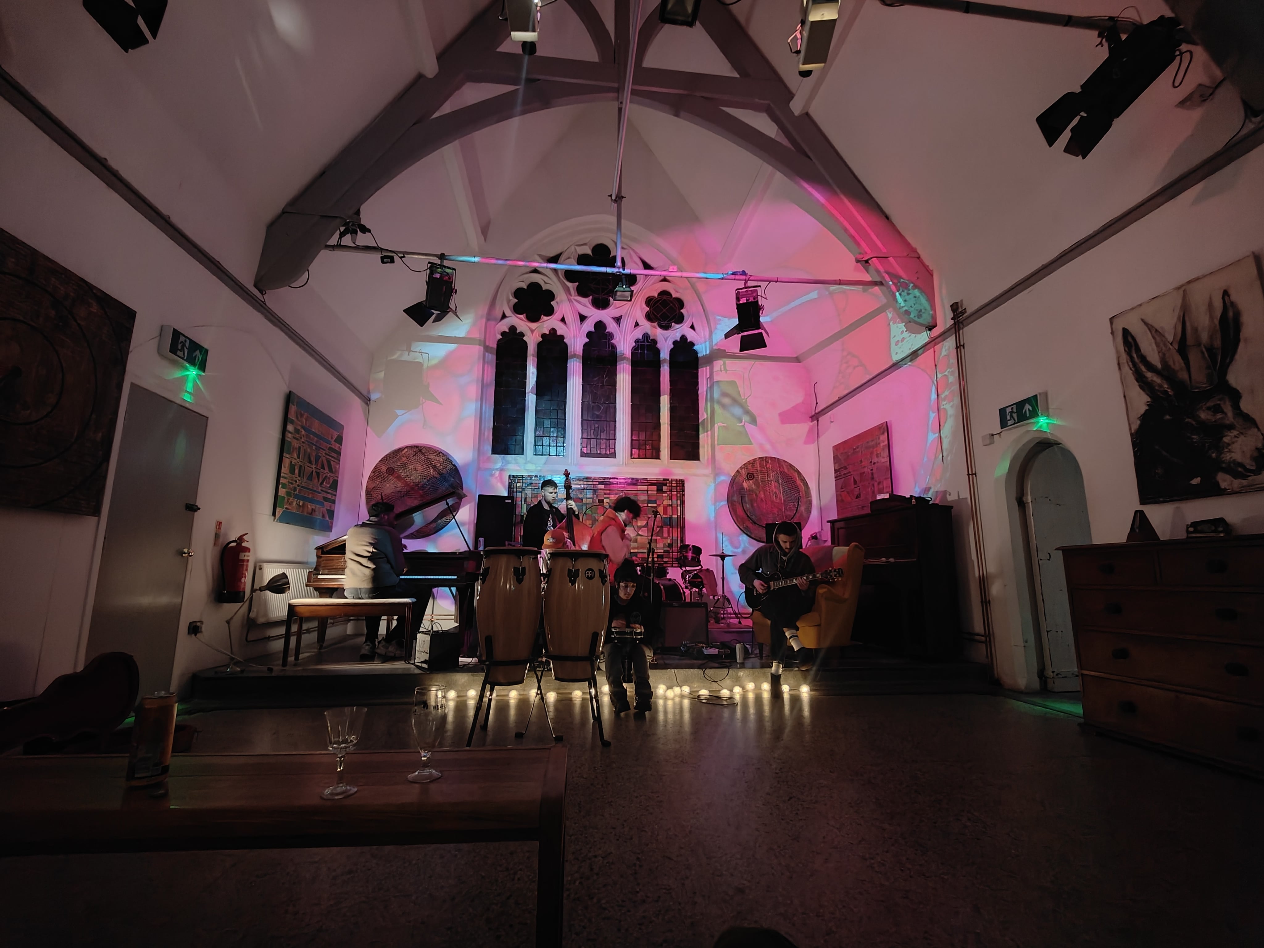 Vibrant St Dunstans House event space with colorful lighting for live music gatherings.