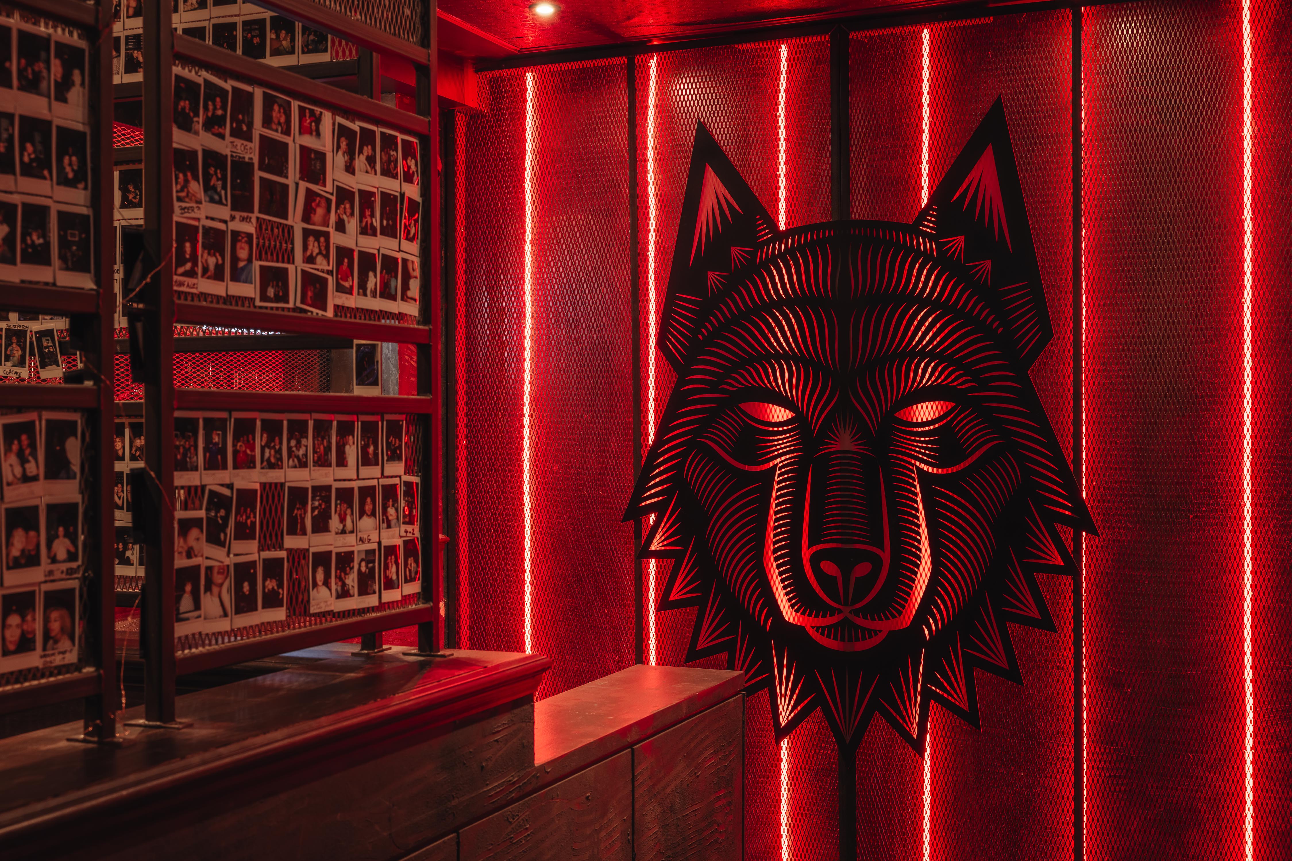 Vibrant Wolfpack West Hampstead venue with red lighting for creative events and networking.