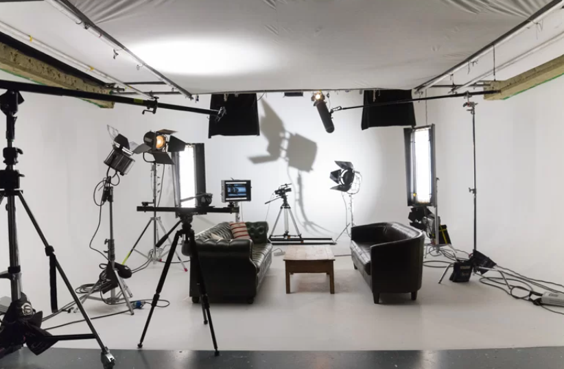 Well-equipped studio setup for hybrid events with professional lighting and audio.