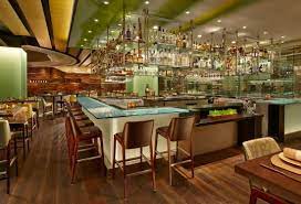 Private dining room bar with sleek design, ideal for networking events and social gatherings.