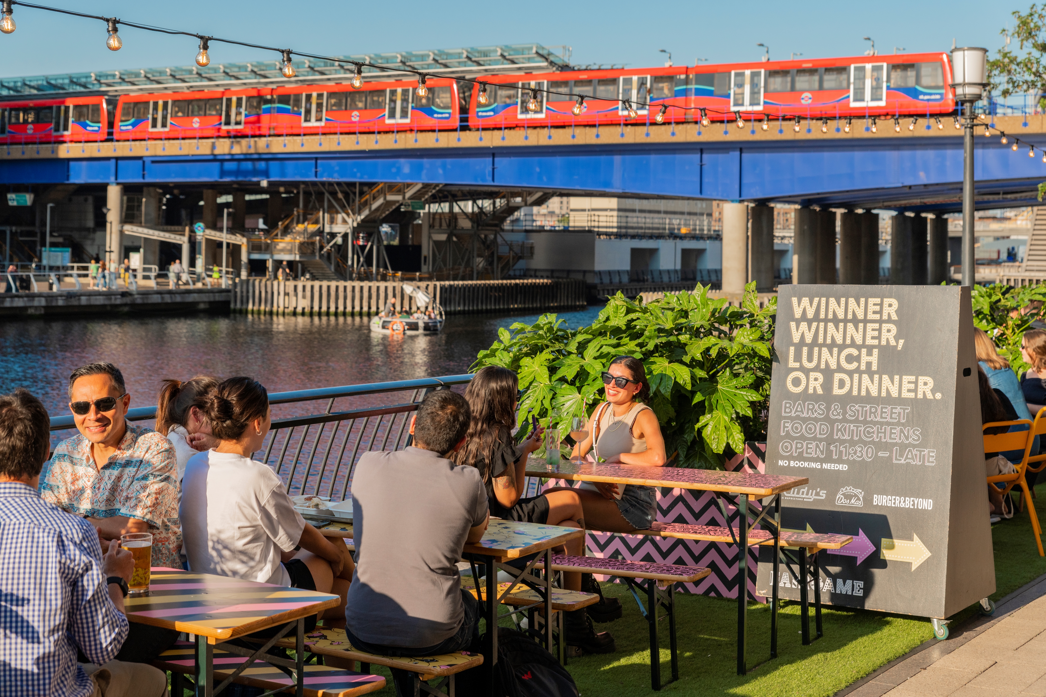 Vibrant outdoor dining at Summer Terrace, ideal for casual networking events by the water.