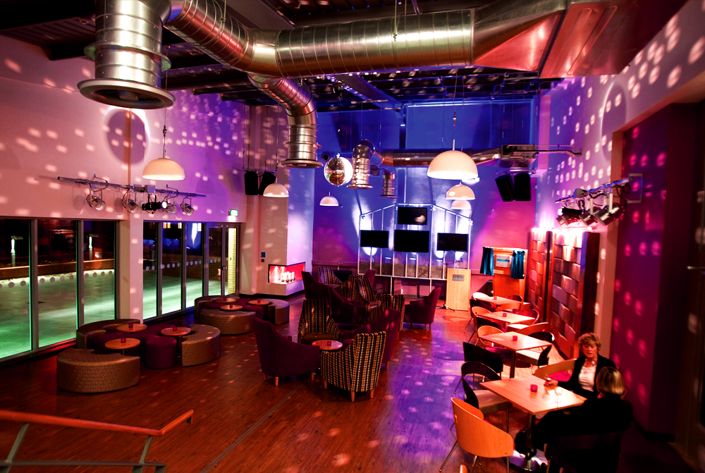 Vibrant Centro Bar event space with modern decor, ideal for parties and celebrations.