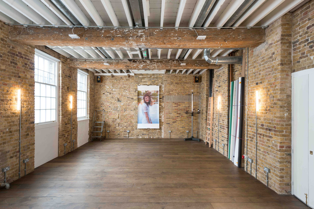 Rustic event space at Paper Mill Studio with natural light for meetings and workshops.