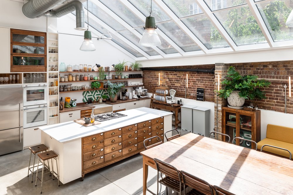 Modern kitchen with skylights in Paper Mill Studio for culinary events and classes.