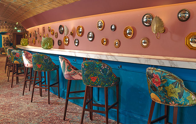 Vibrant 1871 Bar at Royal Albert Hall with eclectic seating for social events.