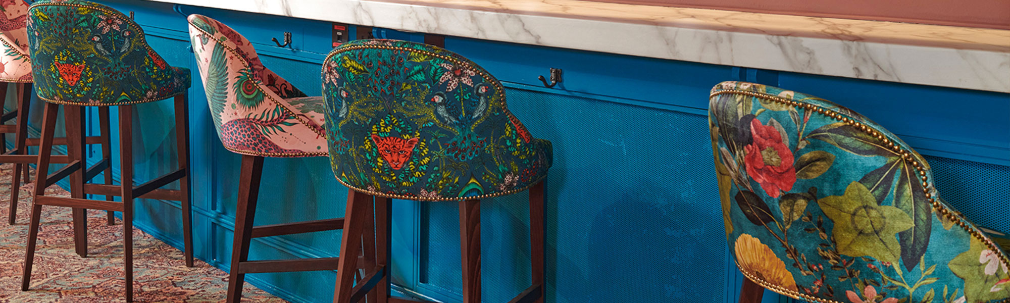 Vibrant 1871 Bar at Royal Albert Hall with unique stools, ideal for networking events.