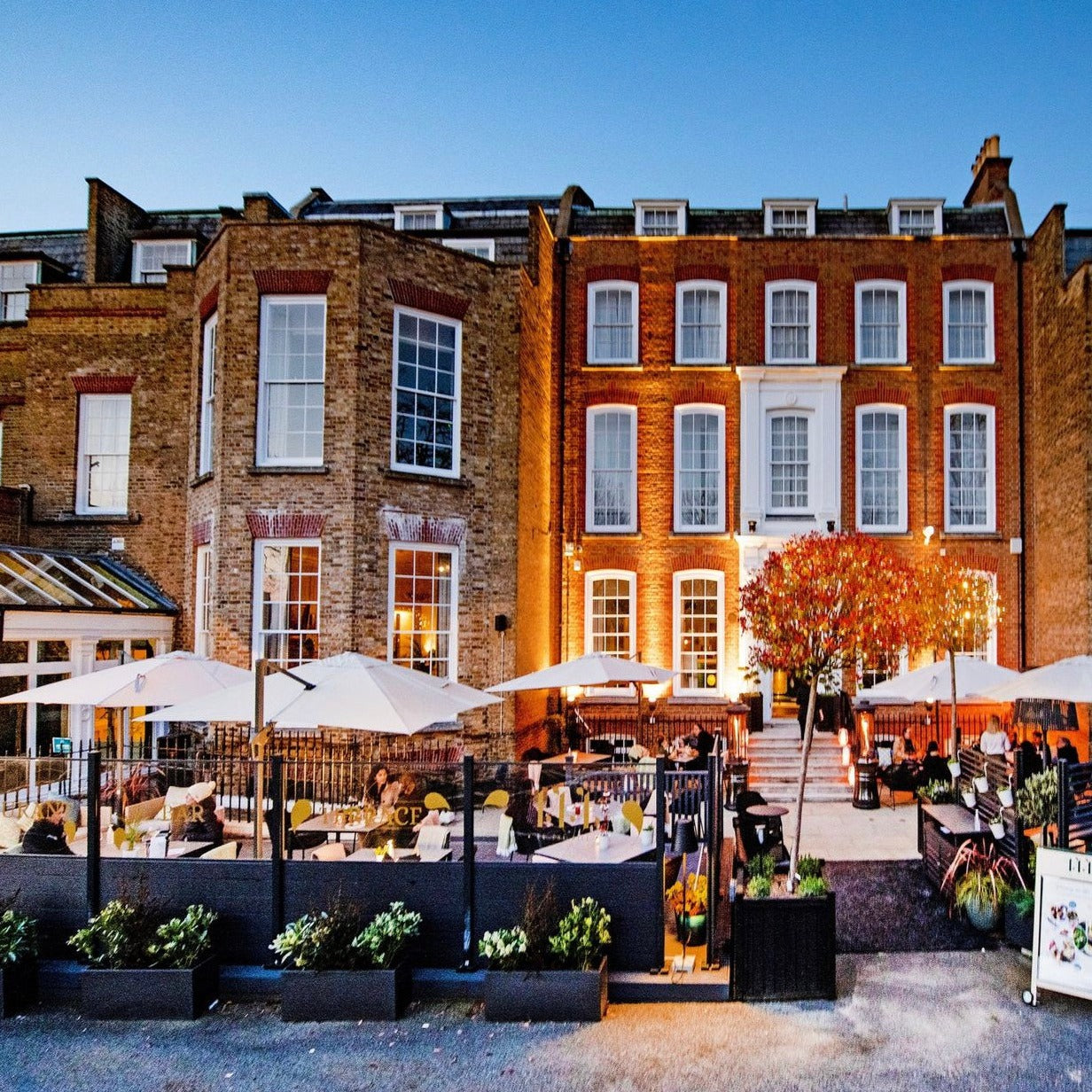 Lounge area at 144 On The Hill with outdoor dining, perfect for events and gatherings.