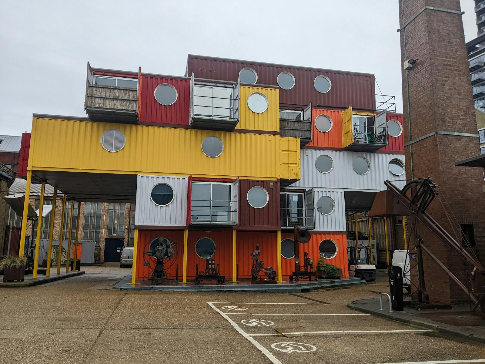 Colorful shipping container venue at Trinity Buoy Wharf for creative meetings and events.