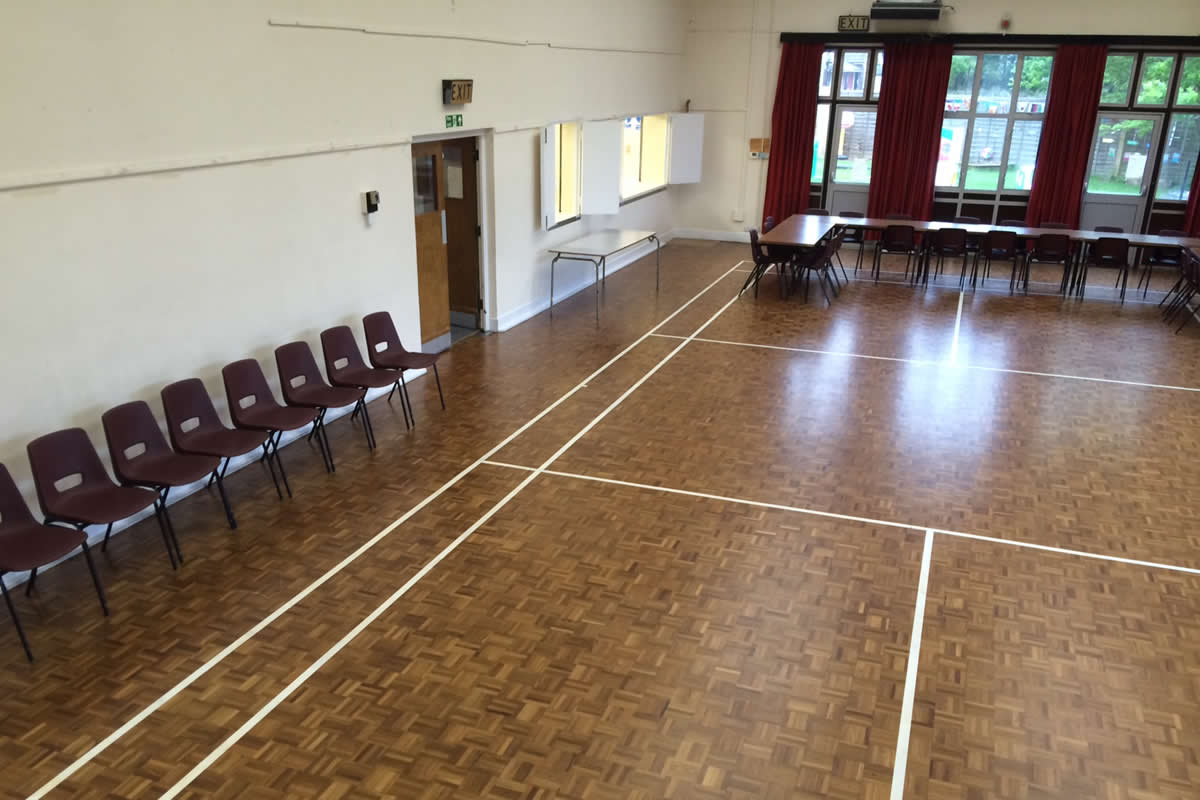Spacious Hall in Arkley Village Hall with polished wooden floor for events and workshops.