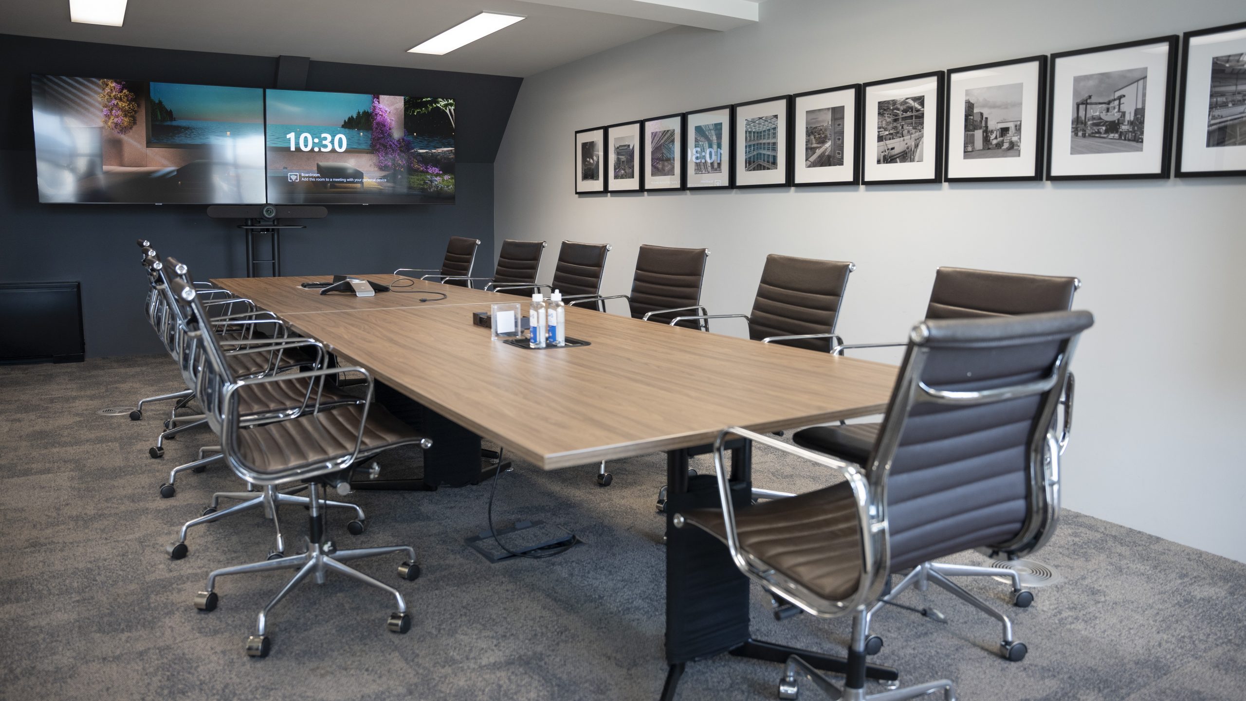 Modern conference room in Hackney Venues with large table for meetings and presentations.