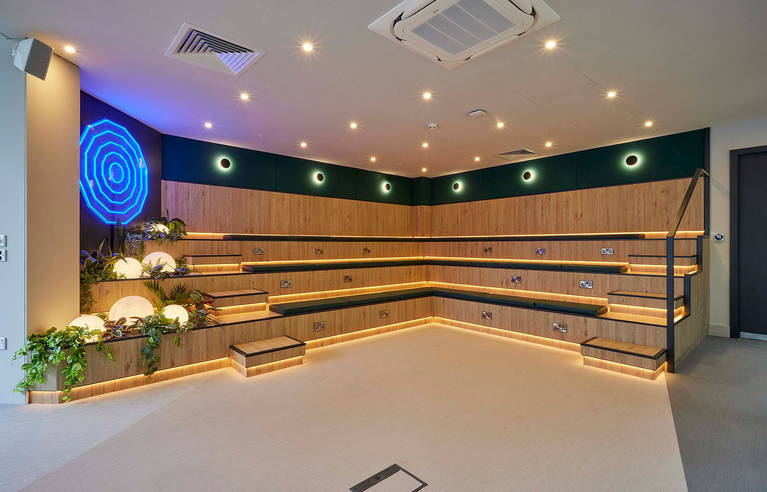 Modern tiered seating in Colony Fabrica's versatile presentation space for workshops.