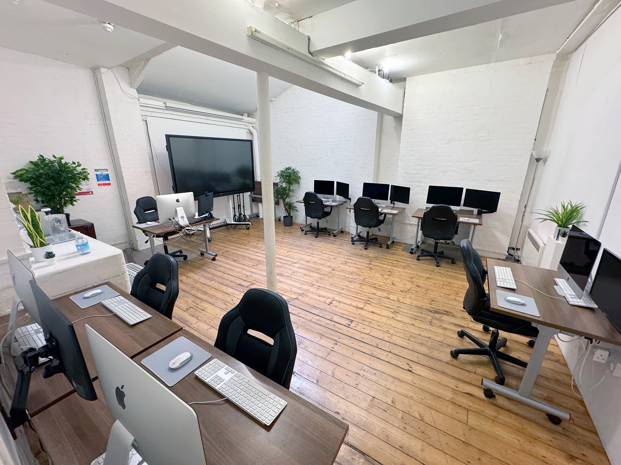 Digital Media Training Room with computers, ideal for workshops and collaborative events.