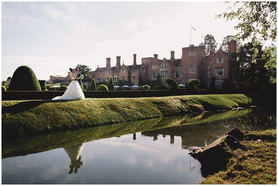 Couple in formal attire at Magnolia Lawn, Great Fosters, ideal for weddings and events.
