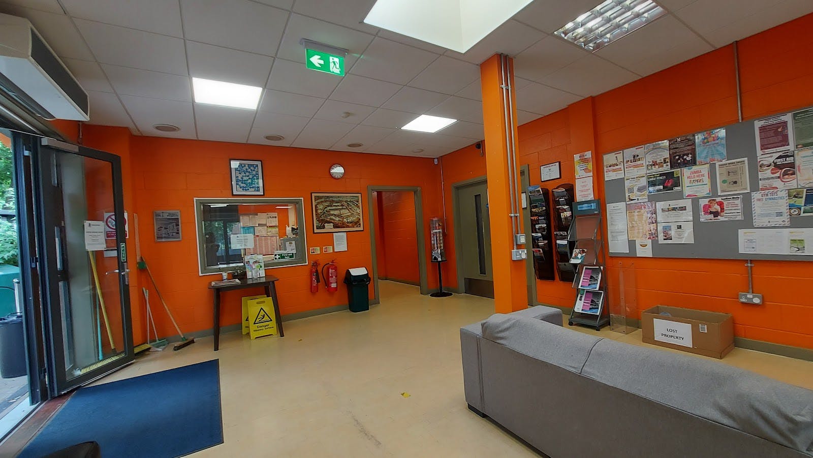 Rotherhithe Hall reception with orange wall, ideal for events and networking.