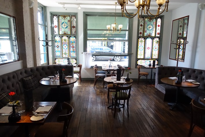 Elegant venue with stained glass windows for networking events and private gatherings.