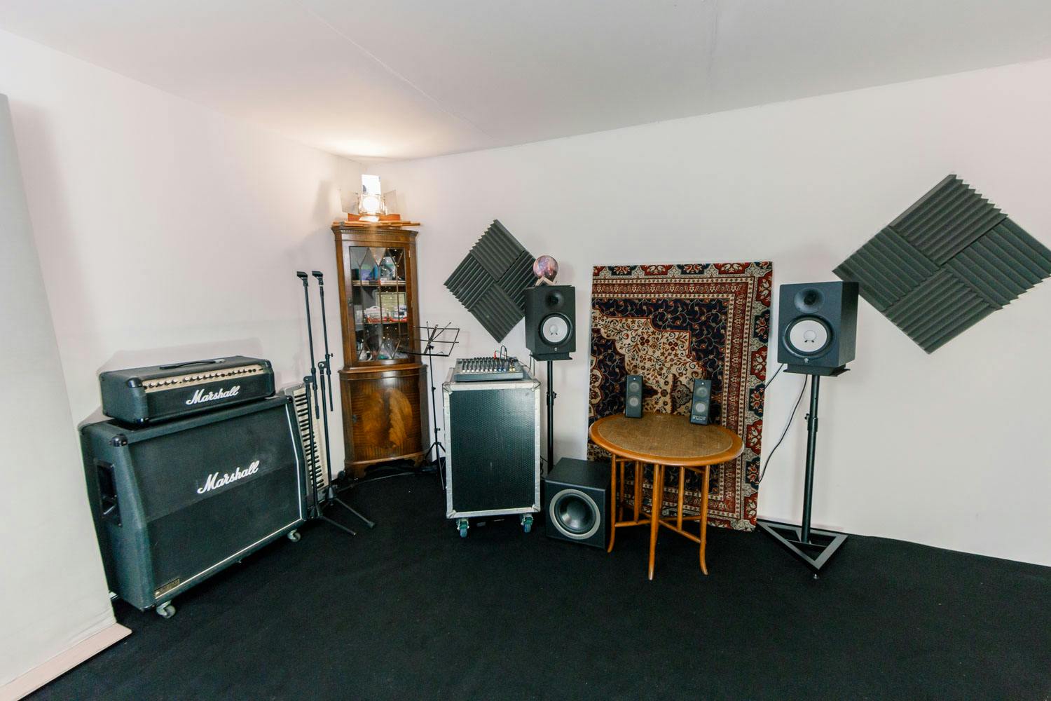 Rehearsal Studio at Sic Lick: cozy, acoustically treated space for music events.