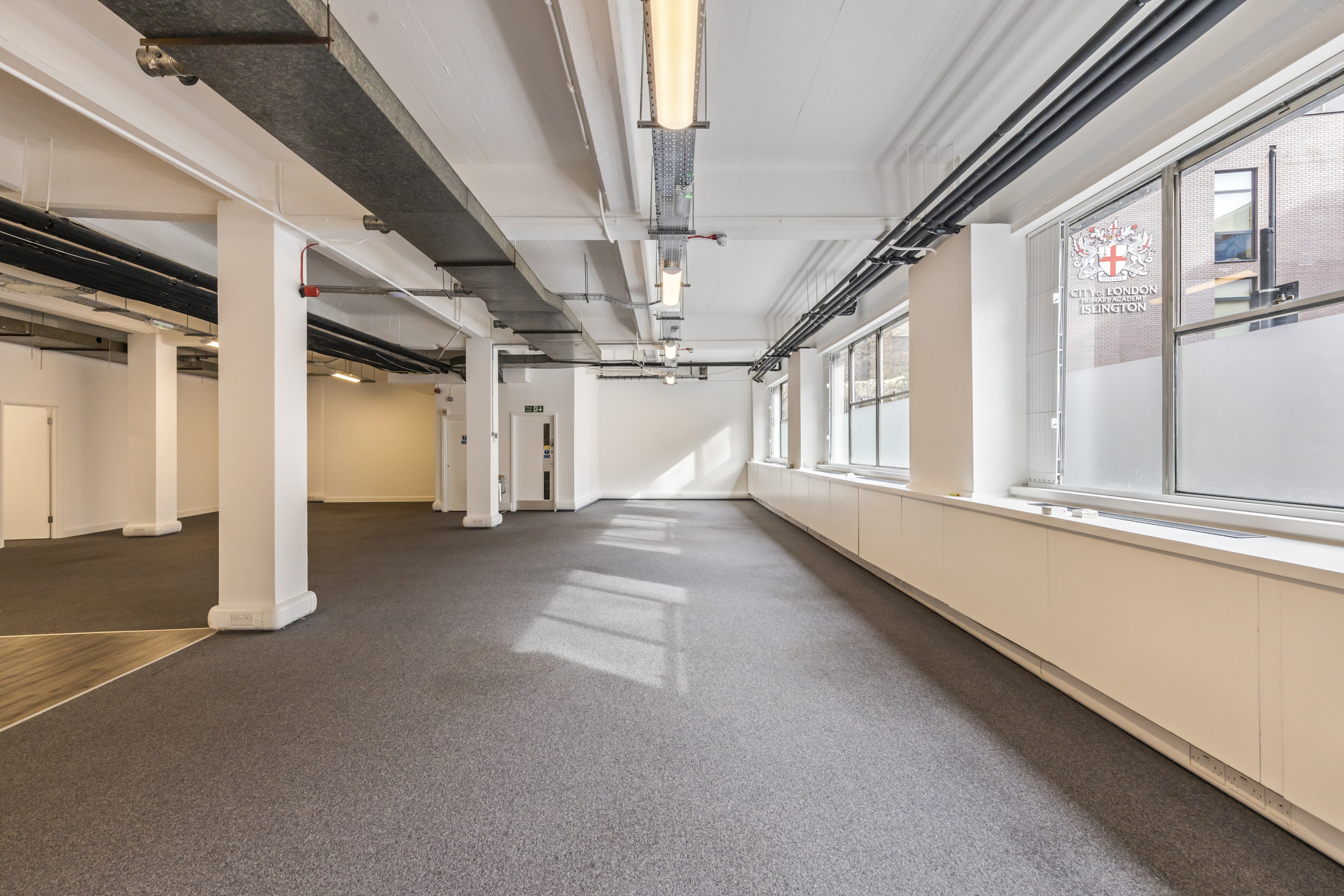 Spacious event space with high ceilings at 24-26 Baltic St W for conferences and workshops.