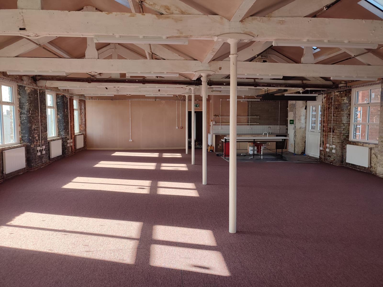 Spacious New Islington Mill venue with high ceilings for events and workshops.