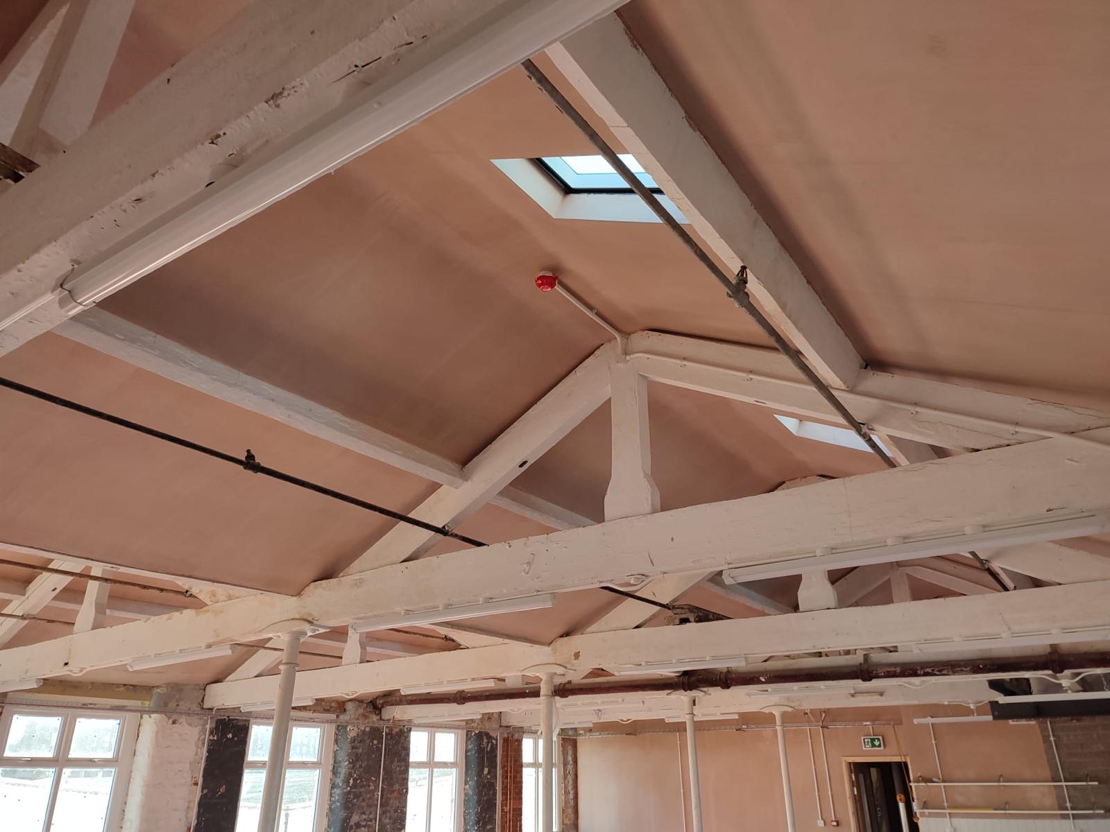 Spacious New Islington Mill venue with high ceilings for events and gatherings.