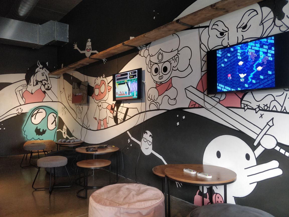 Vibrant Loading Bar Peckham with playful wall art for casual events and gatherings.