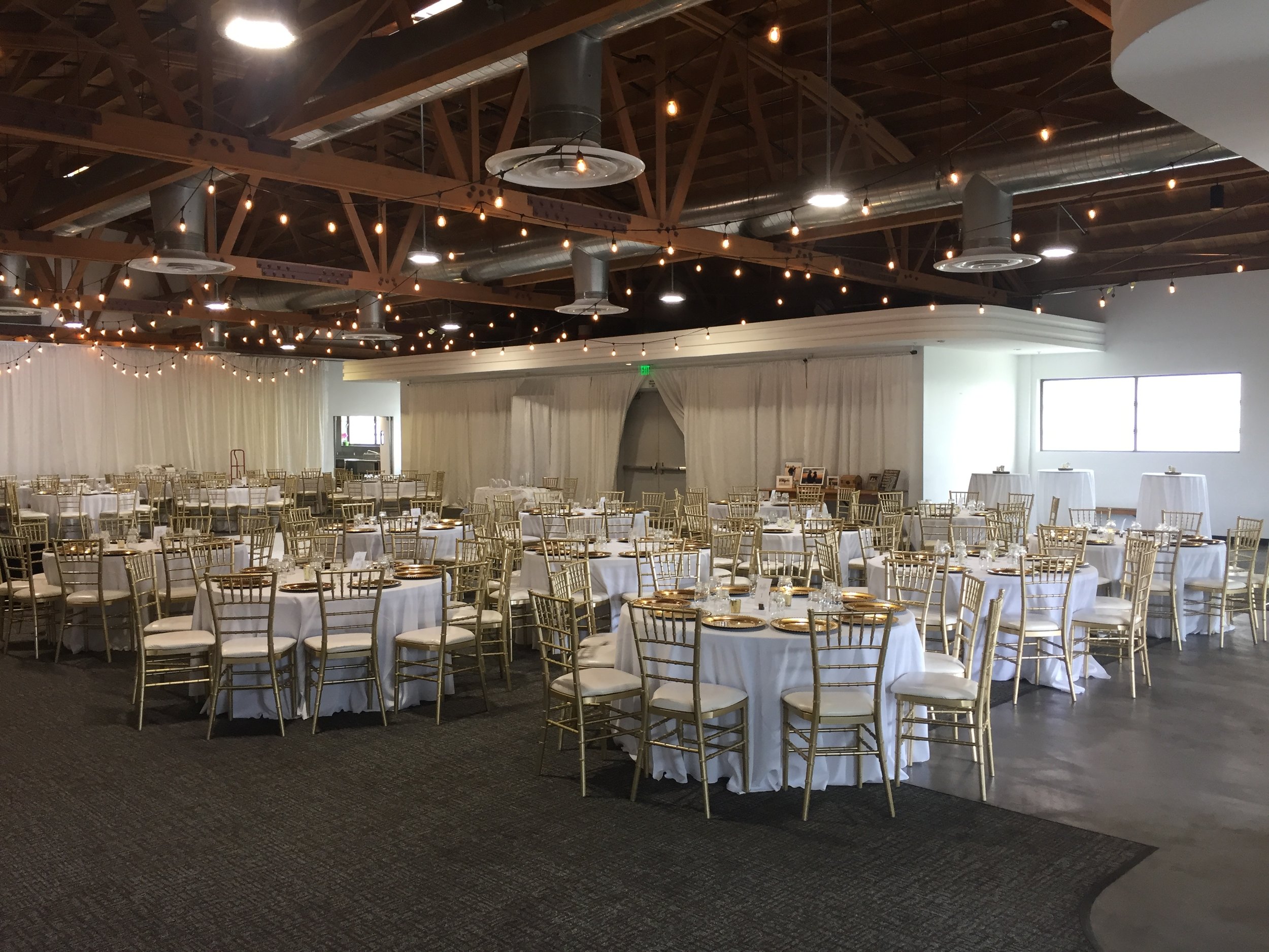 Main Ballroom in The Catalina Room with elegant round tables, ideal for weddings and corporate events.