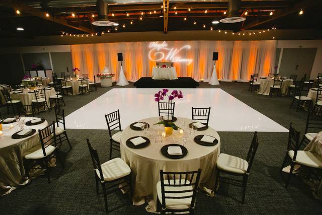 Elegant Main Ballroom with round tables, ideal for weddings and formal events.