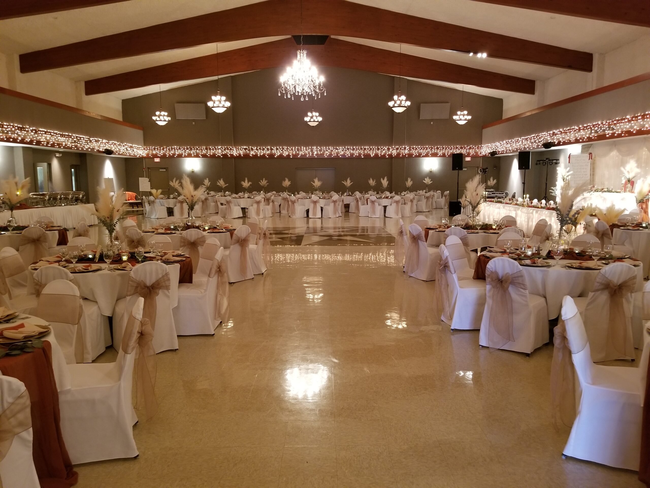 Elegant Saint Mina Banquet Hall with soft lighting, perfect for weddings and formal events.