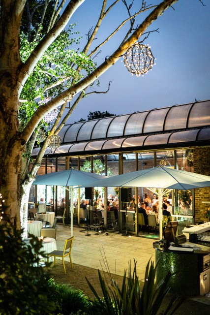 Outdoor dining space at The Conservatory, ideal for events and gatherings.