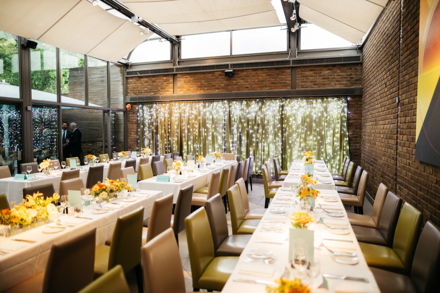 Elegant event space with floral centerpieces for corporate dinners and gatherings.