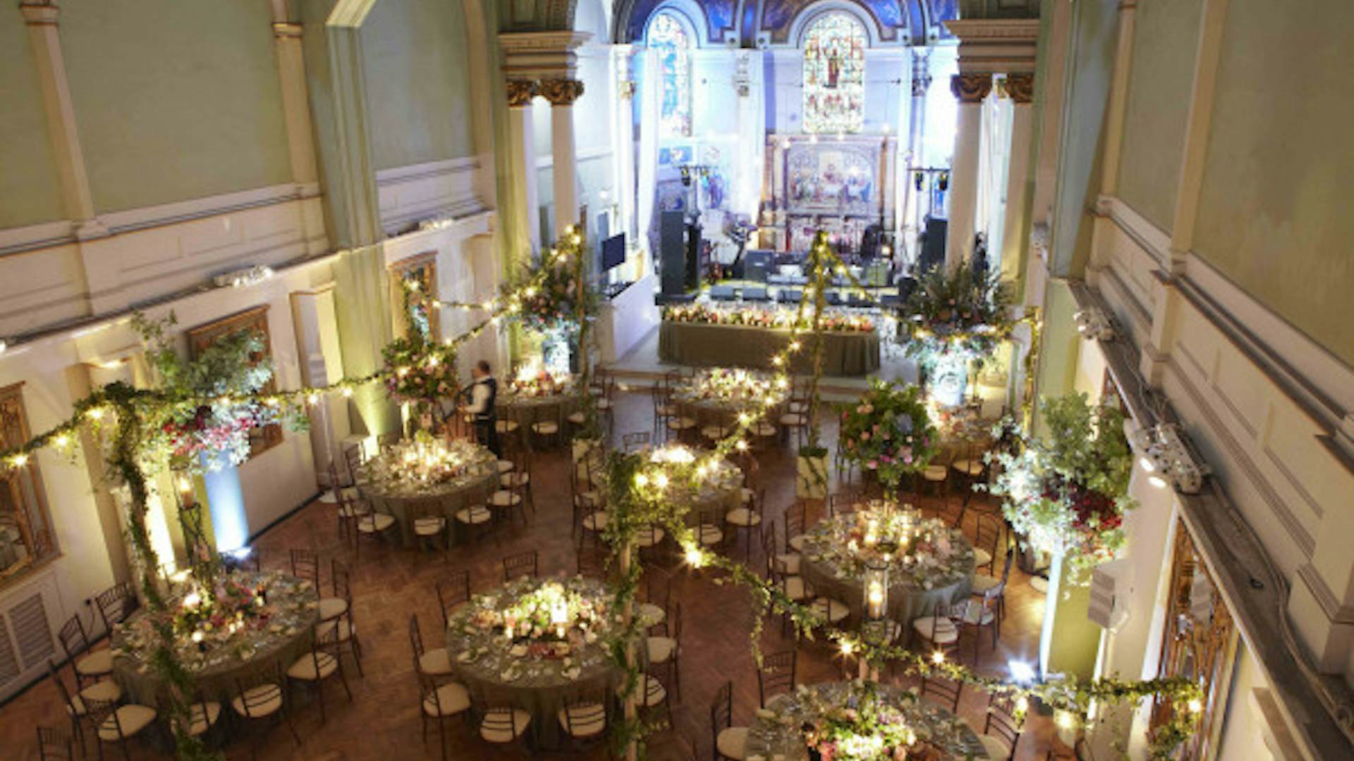 Elegant event space in Soane Hall with floral centerpieces, perfect for weddings.