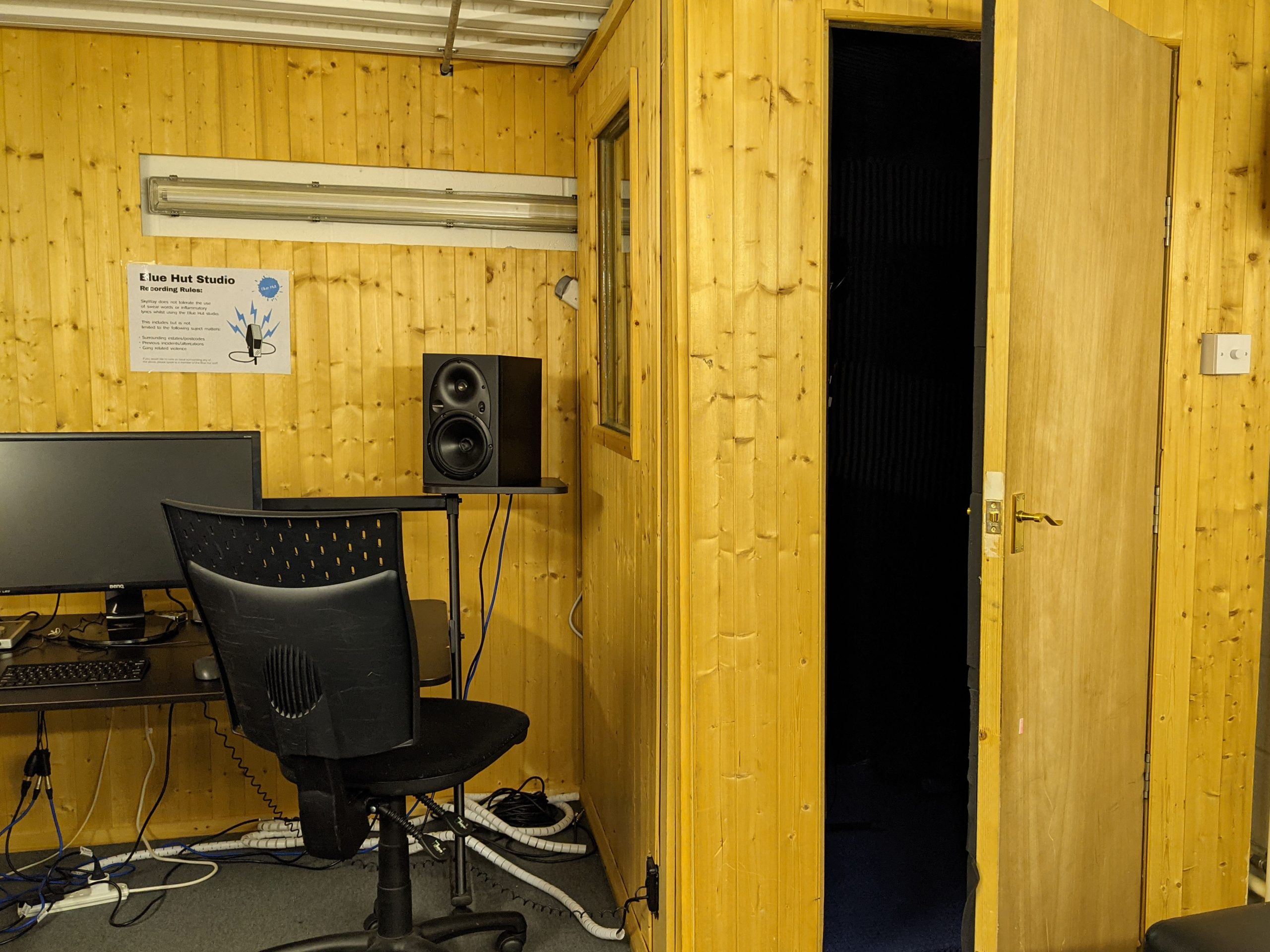 Soundproof booth in Yellow Hat Studios for high-quality recording and virtual meetings.