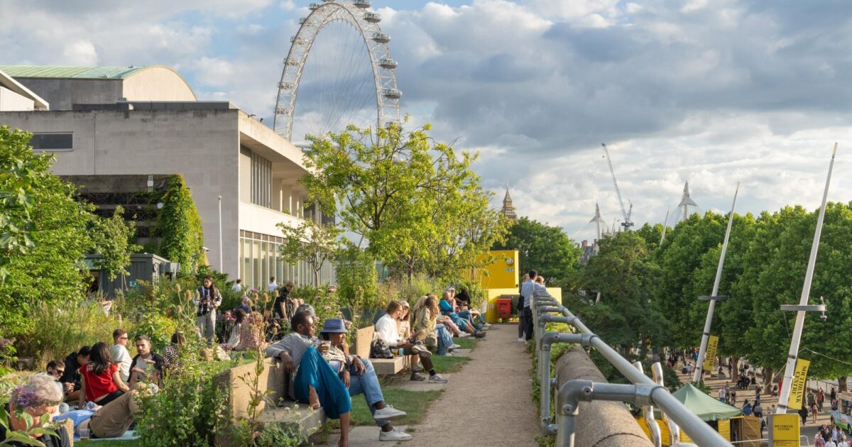 Queen Elizabeth Hall Roof Garden with greenery, seating, and London Eye backdrop for events.