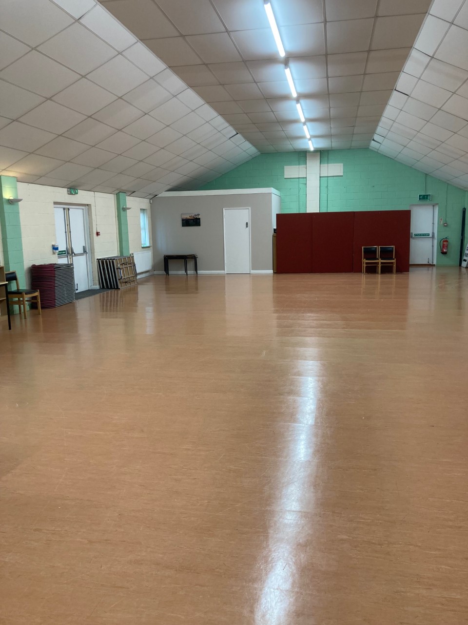 St. Peter's Hall: spacious event space with polished floors for meetings and workshops.