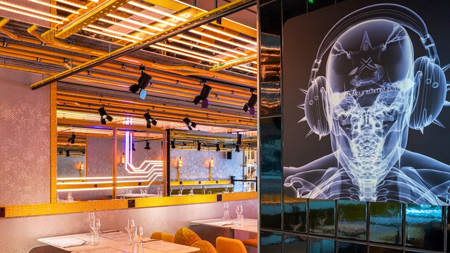 Modern restaurant venue with dynamic lighting for creative events and networking.