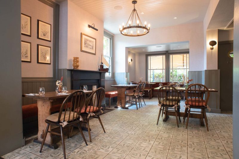 Charming garden dining space with warm lighting for intimate gatherings and corporate events.