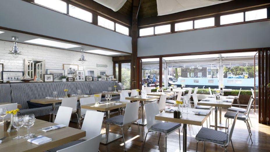 Modern dining room in The Summerhouse, ideal for intimate meetings and events.