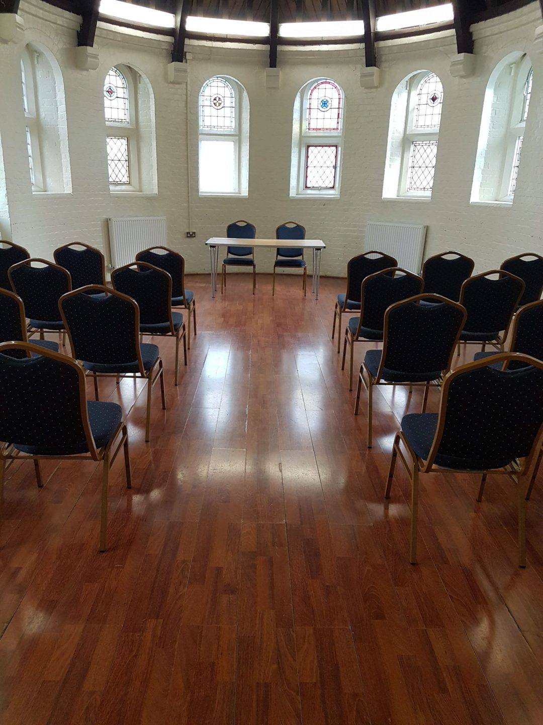 Small Hall in Wheatsheaf Community Hall set up for workshops and discussions.