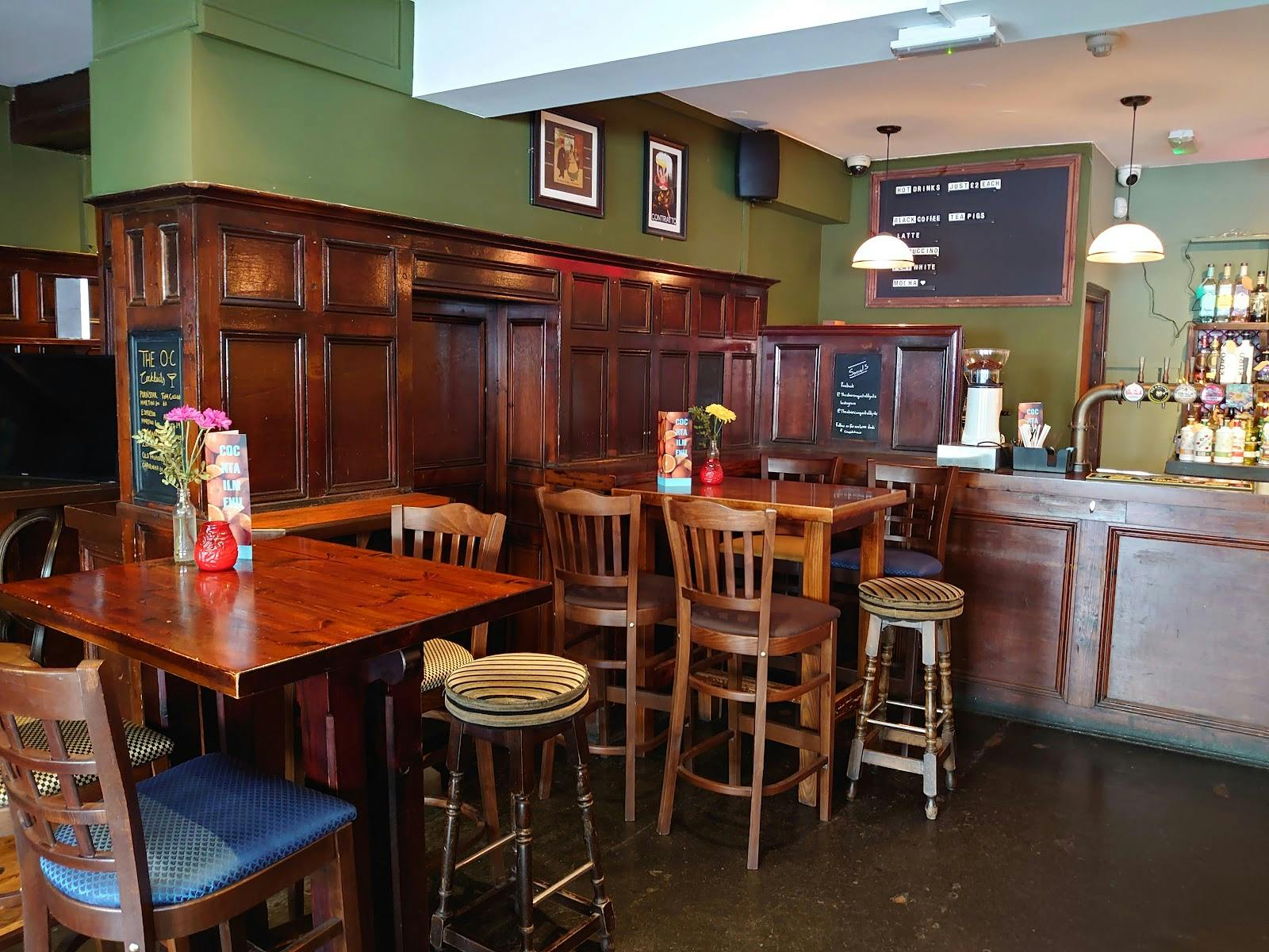 Cozy pub interior with warm wood tones, ideal for networking events and casual meetings.