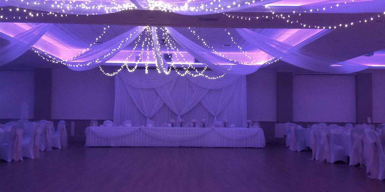 Elegant wedding venue at Oakley House with romantic purple lighting and fairy lights.