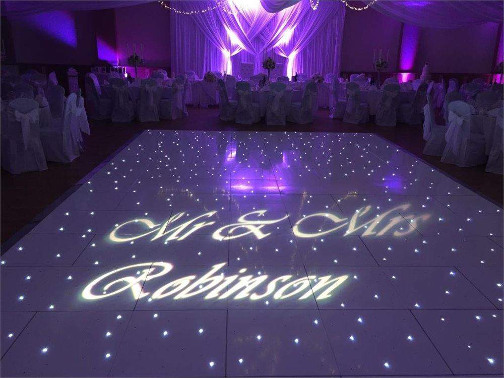 Elegant wedding space at Oakley House with illuminated dance floor and romantic ambiance.