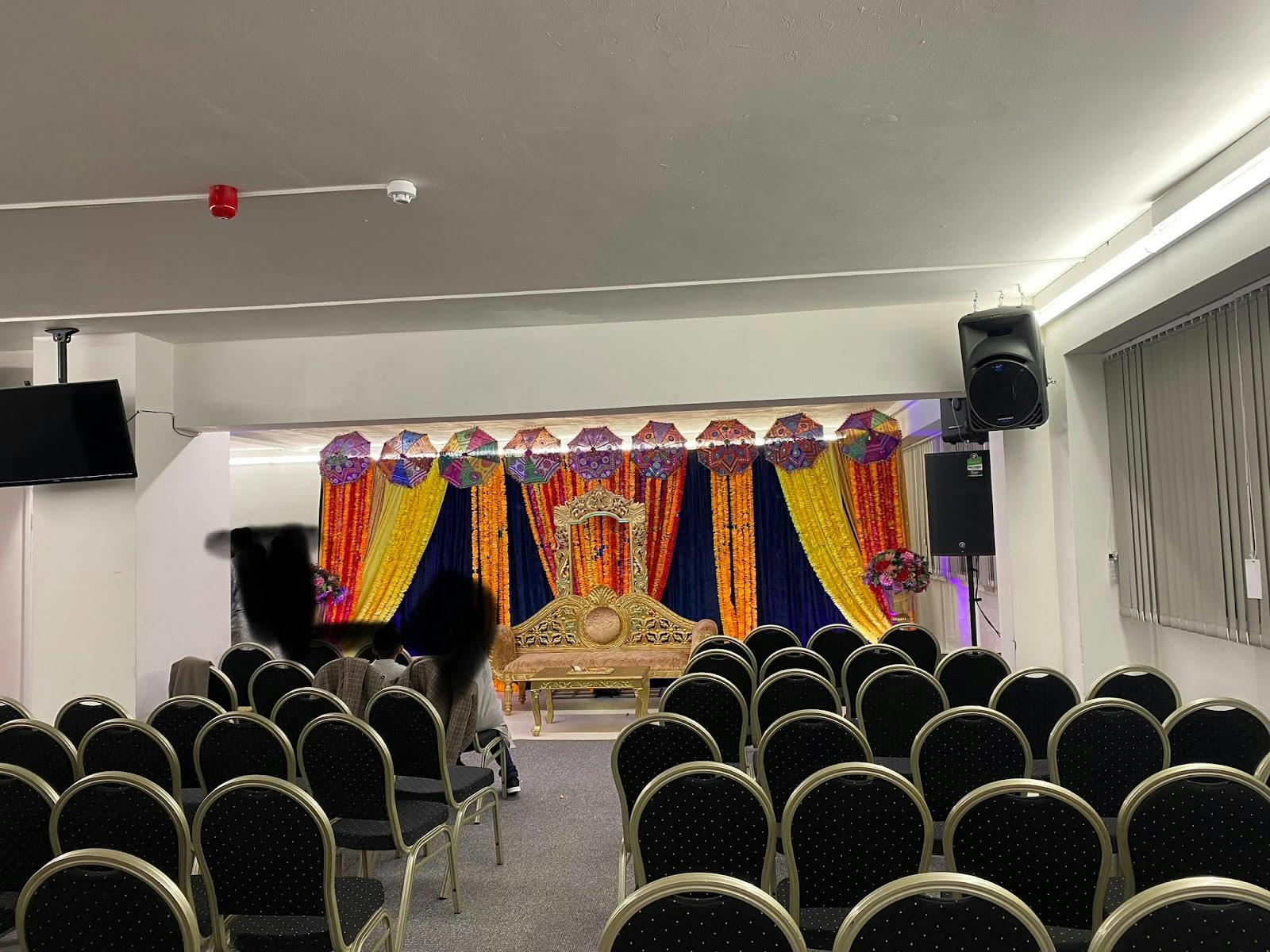 Kingfisher Hall event space with vibrant drapery for weddings and cultural celebrations.