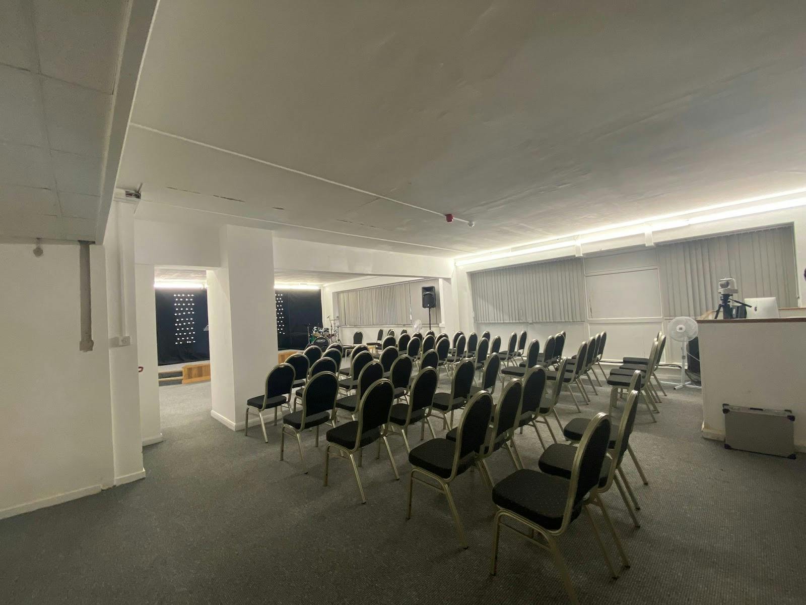 Kingfisher Hall event space with chairs, ideal for presentations and workshops.